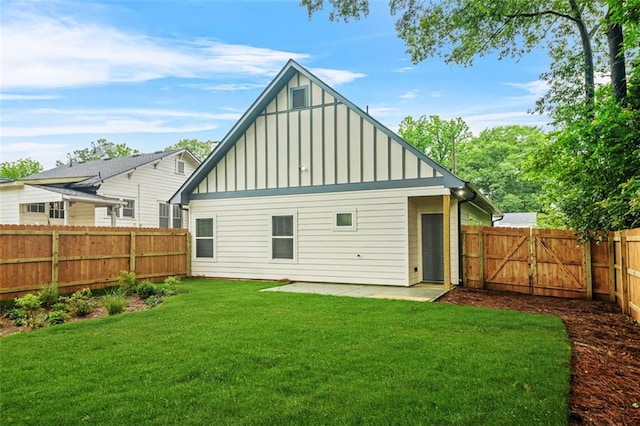 623 Hamilton E Holmes Dr NW, Atlanta, GA 30318 - back of property featuring board and batten siding, a fenced backyard, a patio, and a gate