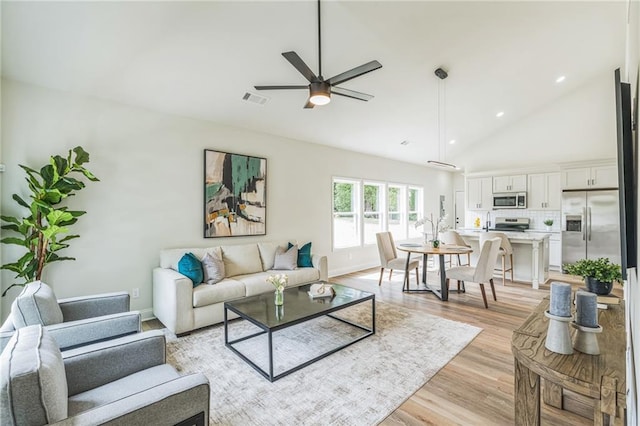 623 Hamilton E Holmes Dr NW, Atlanta, GA 30318 - living area featuring light wood finished floors, a ceiling fan, high vaulted ceiling, and recessed lighting