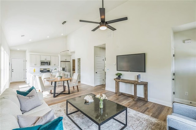 623 Hamilton E Holmes Dr NW, Atlanta, GA 30318 - living area with high vaulted ceiling, light wood finished floors, a ceiling fan, and recessed lighting