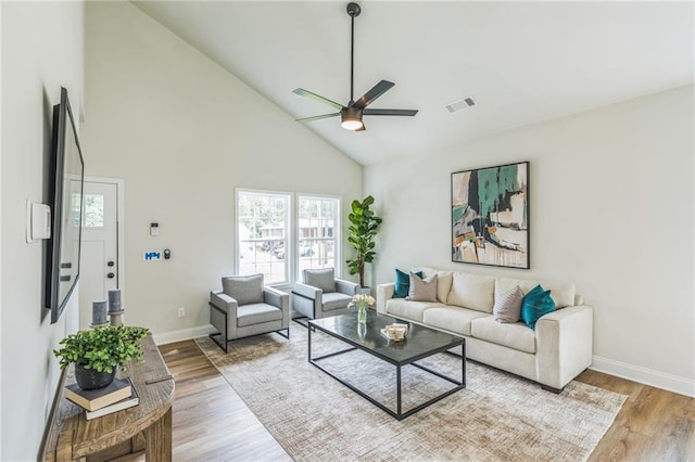 623 Hamilton E Holmes Dr NW, Atlanta, GA 30318 - living area featuring a ceiling fan, high vaulted ceiling, healthy amount of natural light, and wood finished floors