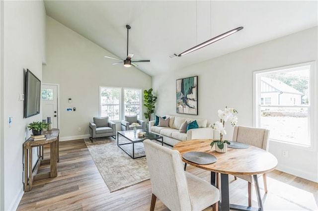 623 Hamilton E Holmes Dr NW, Atlanta, GA 30318 - dining space with light wood-style floors, a ceiling fan, and high vaulted ceiling