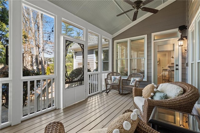 sunroom / solarium featuring vaulted ceiling and ceiling fan