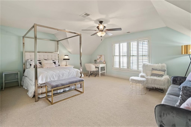 bedroom featuring carpet floors, visible vents, vaulted ceiling, and a ceiling fan