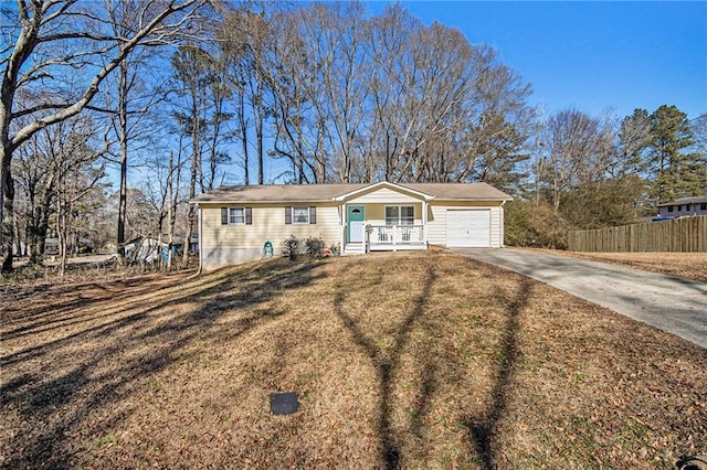 single story home with a garage and a front yard