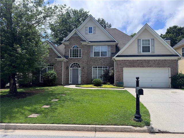 458 Vinings Vintage Cir, Mableton, GA 30126 - traditional-style house featuring an attached garage, driveway, brick siding, and a front lawn