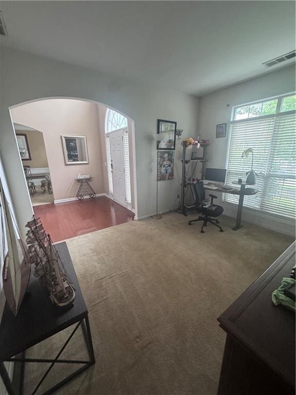 458 Vinings Vintage Cir, Mableton, GA 30126 - home office with arched walkways, carpet floors, and baseboards