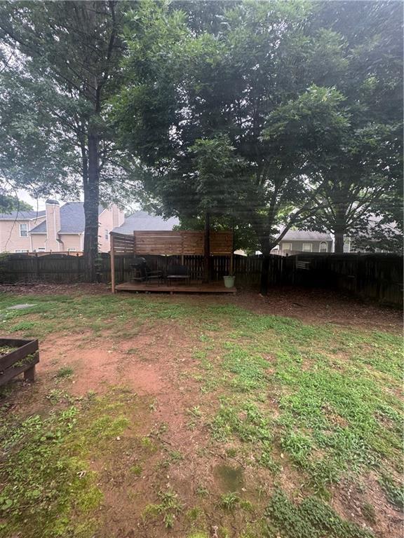 458 Vinings Vintage Cir, Mableton, GA 30126 - fenced backyard featuring a deck