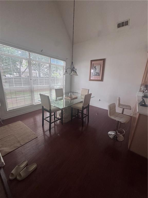 458 Vinings Vintage Cir, Mableton, GA 30126 - dining area with wood finished floors and high vaulted ceiling