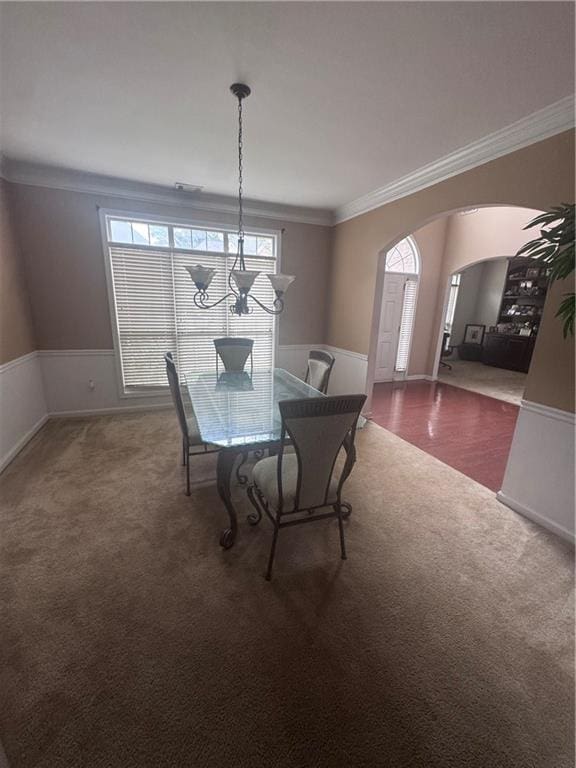 458 Vinings Vintage Cir, Mableton, GA 30126 - carpeted dining space with arched walkways, ornamental molding, wainscoting, and baseboards