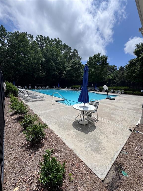 458 Vinings Vintage Cir, Mableton, GA 30126 - community pool featuring a patio