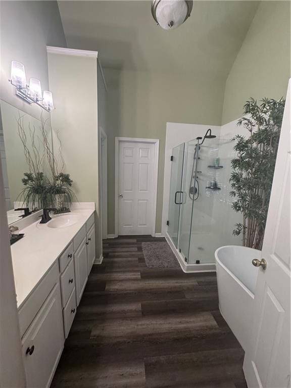 458 Vinings Vintage Cir, Mableton, GA 30126 - full bathroom with vanity, a stall shower, wood finished floors, a soaking tub, and vaulted ceiling