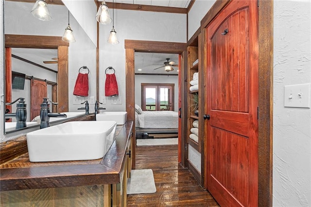 bathroom featuring hardwood / wood-style floors, ceiling fan, and vanity