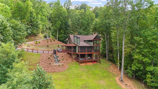 exterior space featuring a lawn and a wooden deck