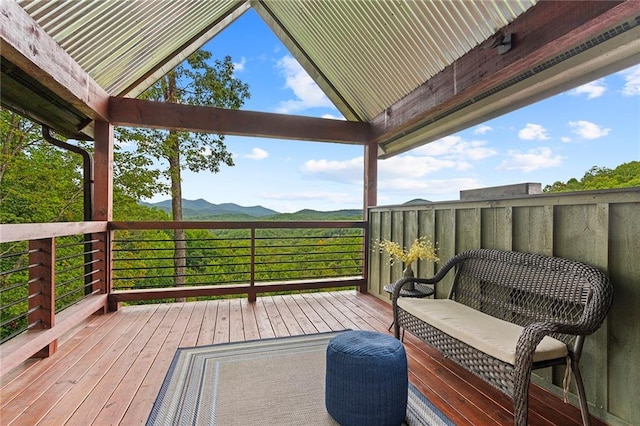 additional living space featuring wood walls, a notable chandelier, hardwood / wood-style floors, and vaulted ceiling with beams