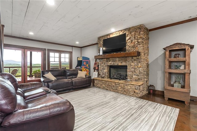 living room with a fireplace, wooden walls, wine cooler, wood-type flooring, and a barn door