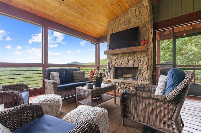 interior space featuring a fireplace, lofted ceiling, and a wealth of natural light