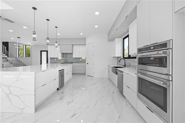 4238 Hamilton Mill Rd, Buford, GA 30519 - kitchen featuring modern cabinets, stainless steel appliances, tasteful backsplash, recessed lighting, and a sink