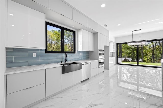 4238 Hamilton Mill Rd, Buford, GA 30519 - kitchen with modern cabinets, stainless steel appliances, white cabinetry, decorative backsplash, and recessed lighting