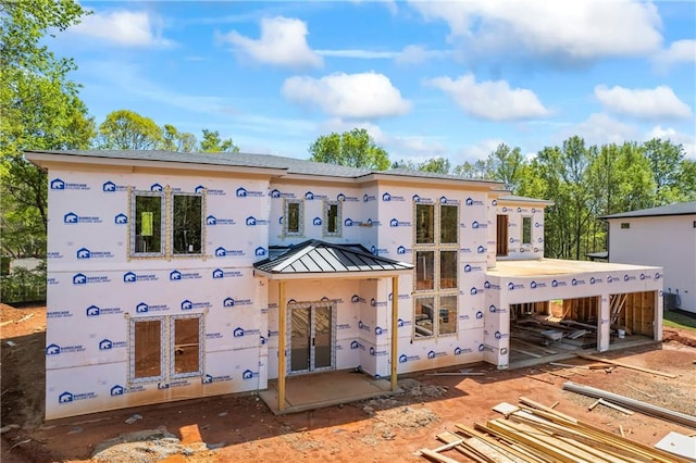 4238 Hamilton Mill Rd, Buford, GA 30519 - rear view of house featuring a standing seam roof and metal roof