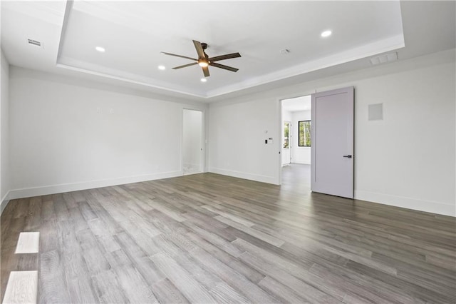 4238 Hamilton Mill Rd, Buford, GA 30519 - spare room with a tray ceiling, ceiling fan, wood finished floors, recessed lighting, and baseboards