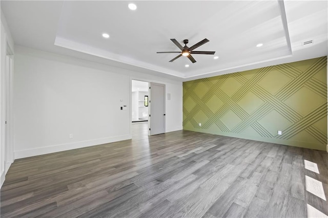 4238 Hamilton Mill Rd, Buford, GA 30519 - unfurnished living room with a raised ceiling, ceiling fan, recessed lighting, wood finished floors, and baseboards