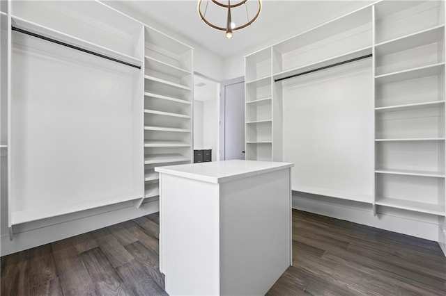 4238 Hamilton Mill Rd, Buford, GA 30519 - walk in closet featuring dark wood finished floors and a chandelier