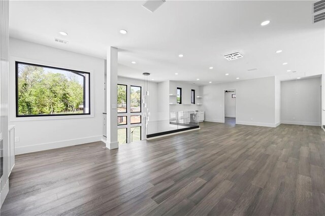 4238 Hamilton Mill Rd, Buford, GA 30519 - unfurnished living room featuring wood finished floors, recessed lighting, and baseboards