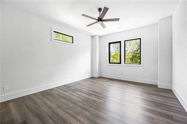 4238 Hamilton Mill Rd, Buford, GA 30519 - unfurnished room featuring dark wood-style flooring, ceiling fan, and baseboards