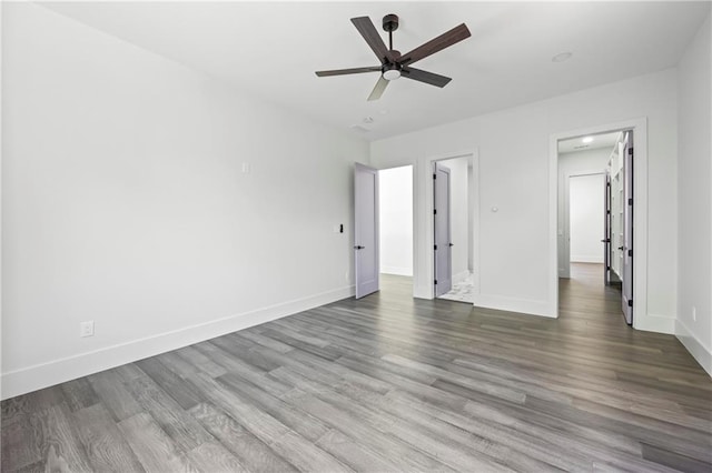 4238 Hamilton Mill Rd, Buford, GA 30519 - unfurnished bedroom featuring baseboards, wood finished floors, and a ceiling fan