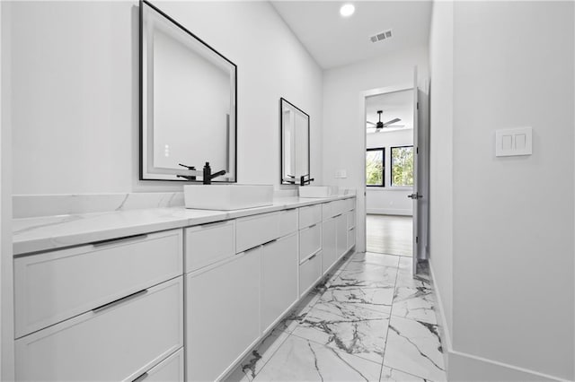 4238 Hamilton Mill Rd, Buford, GA 30519 - bathroom featuring marble look tiles, double vanity, recessed lighting, baseboards, and ceiling fan