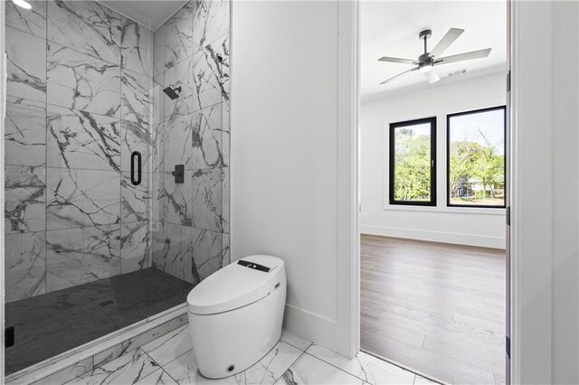 4238 Hamilton Mill Rd, Buford, GA 30519 - full bathroom featuring a marble finish shower, marble look tile flooring, toilet, baseboards, and ceiling fan