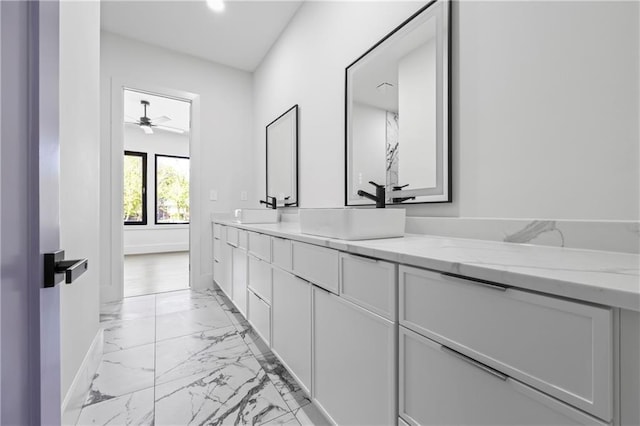 4238 Hamilton Mill Rd, Buford, GA 30519 - bathroom featuring marble finish flooring, double vanity, a ceiling fan, and baseboards