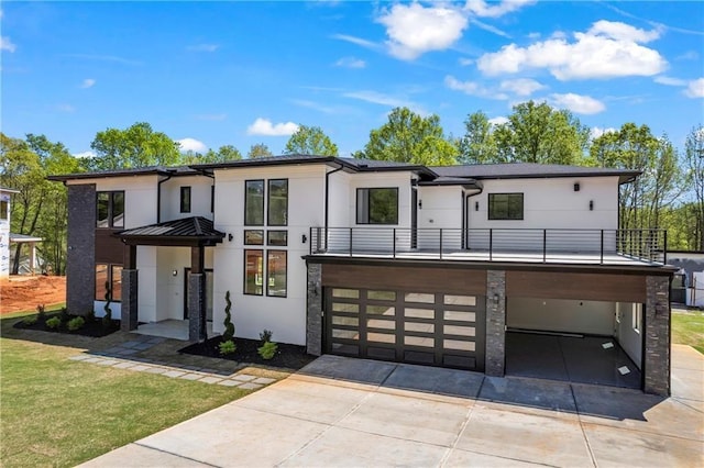 4238 Hamilton Mill Rd, Buford, GA 30519 - contemporary home featuring a balcony, stucco siding, concrete driveway, a garage, and a front lawn