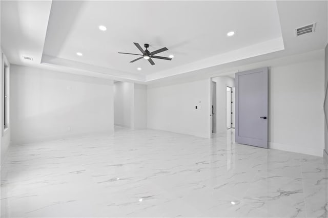 4238 Hamilton Mill Rd, Buford, GA 30519 - unfurnished room featuring a raised ceiling, recessed lighting, a ceiling fan, baseboards, and light marble finish flooring