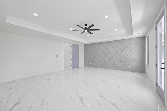 4238 Hamilton Mill Rd, Buford, GA 30519 - empty room with a raised ceiling, a ceiling fan, recessed lighting, and baseboards