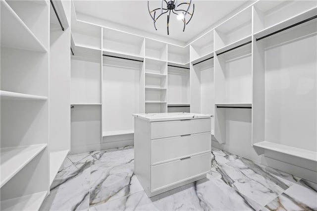 4238 Hamilton Mill Rd, Buford, GA 30519 - walk in closet featuring a chandelier and light marble finish flooring