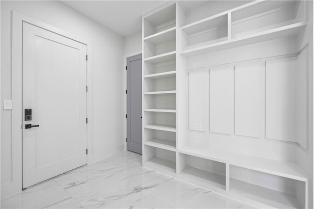 4238 Hamilton Mill Rd, Buford, GA 30519 - mudroom with marble look tile flooring and baseboards
