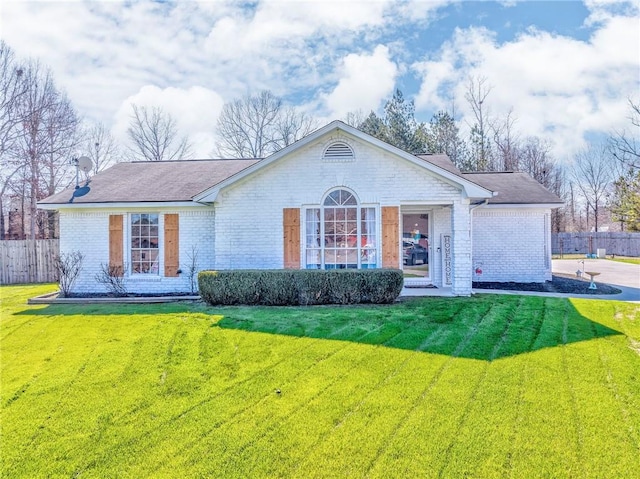 ranch-style home with a front yard