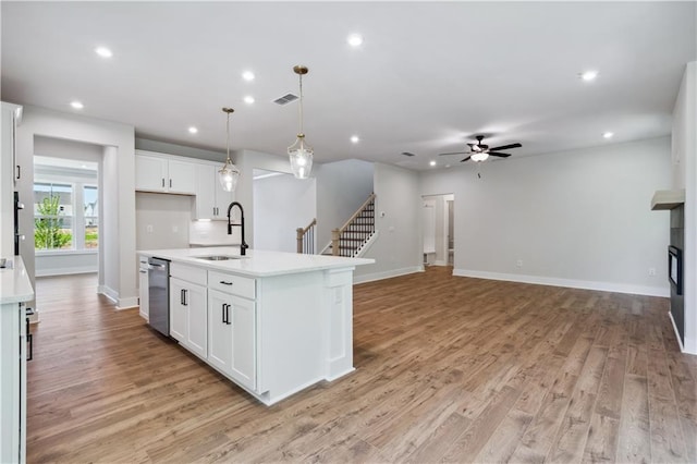 4002 Adler Cir, Buford, GA 30519 - kitchen with a ceiling fan, a sink, dishwasher, light countertops, and recessed lighting
