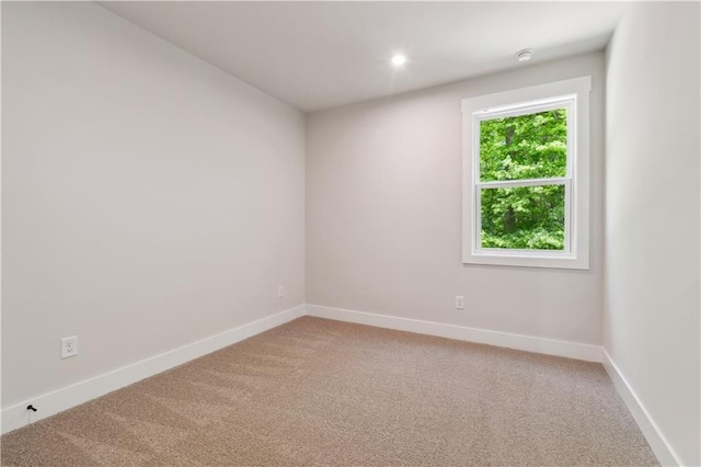 4002 Adler Cir, Buford, GA 30519 - spare room with baseboards and light colored carpet