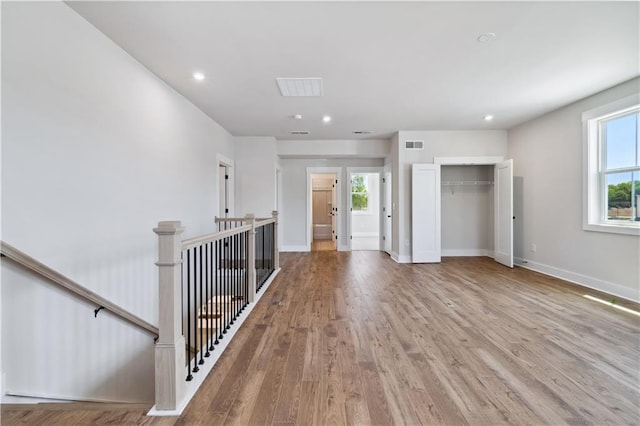 4002 Adler Cir, Buford, GA 30519 - interior space with wood finished floors, visible vents, a wealth of natural light, and an upstairs landing
