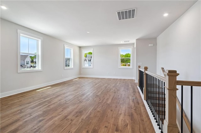 4002 Adler Cir, Buford, GA 30519 - spare room featuring baseboards, wood finished floors, and visible vents