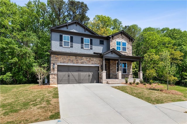 4002 Adler Cir, Buford, GA 30519 - craftsman-style house featuring a garage, stone siding, a front yard, and concrete driveway