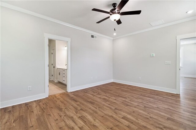 4002 Adler Cir, Buford, GA 30519 - empty room featuring wood finished floors, visible vents, a ceiling fan, ornamental molding, and baseboards