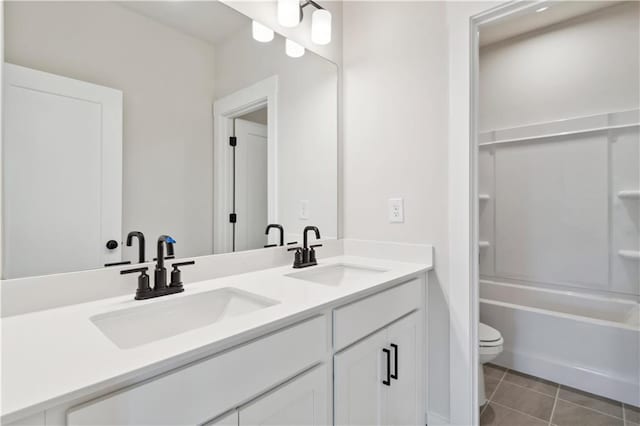 4002 Adler Cir, Buford, GA 30519 - bathroom with tile patterned flooring, double vanity, toilet, and a sink