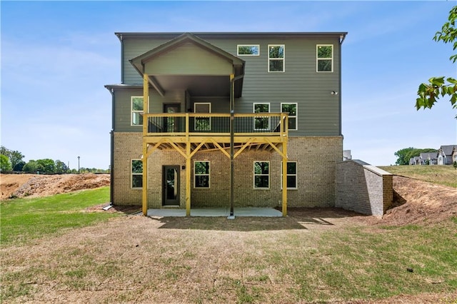 4002 Adler Cir, Buford, GA 30519 - rear view of property with a lawn, brick siding, a patio area, and a balcony