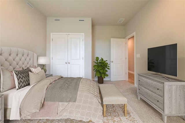 bedroom featuring light carpet and a closet