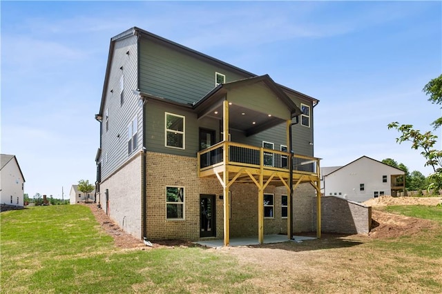 4002 Adler Cir, Buford, GA 30519 - back of property featuring brick siding, a patio area, and a lawn