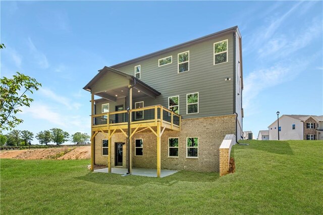 4002 Adler Cir, Buford, GA 30519 - back of house with a deck, brick siding, a yard, and a patio