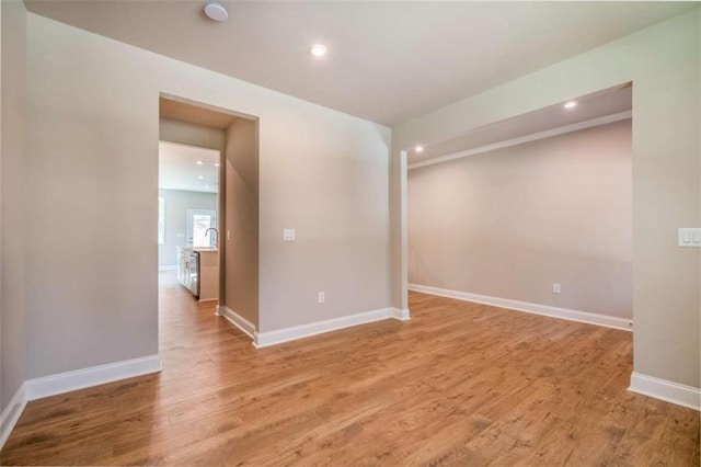 spare room featuring hardwood / wood-style flooring